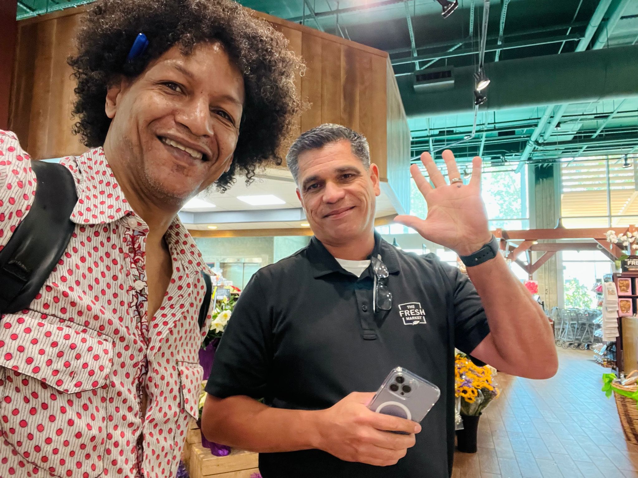 LaRon Batchelor with a Fresh Market partner on the retail floor