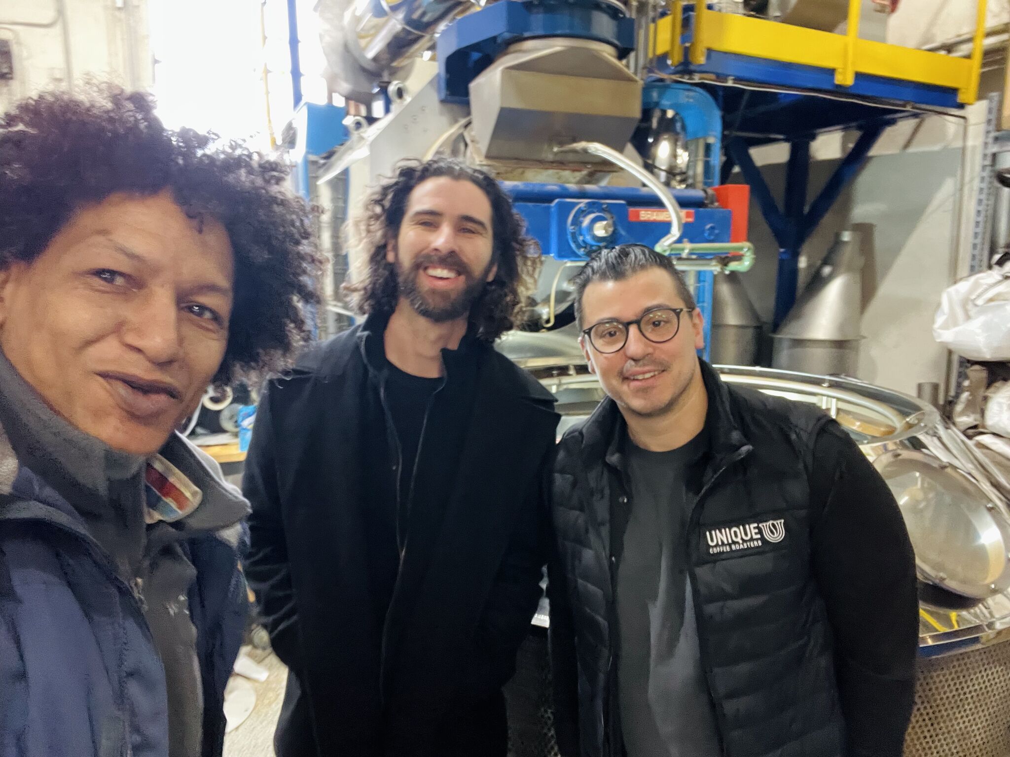 LaRon Batchelor with partners at a coffee roasting facility