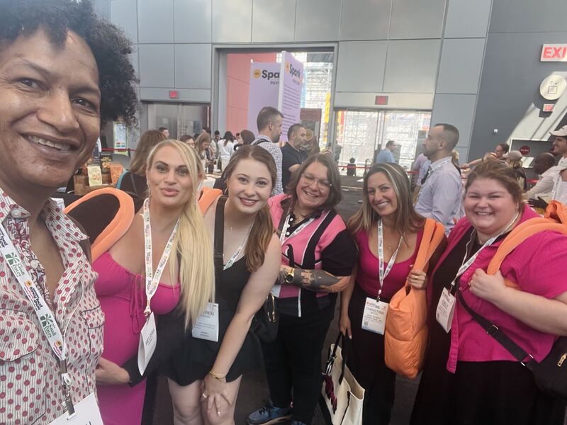 LaRon with a group at a trade show
