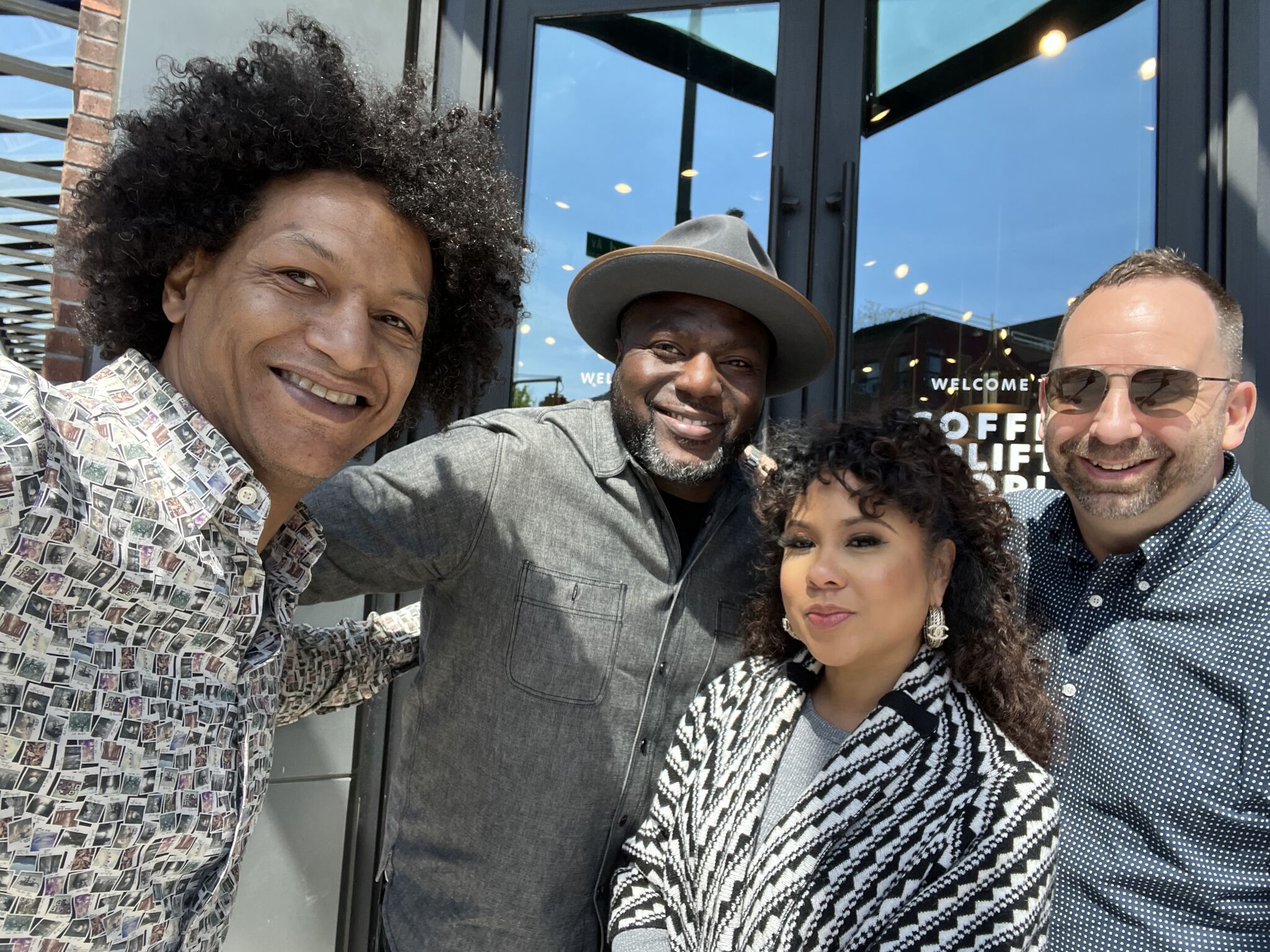 LaRon Batchelor with friends outside a Coffee Uplifts People storefront